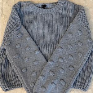light blue sweater